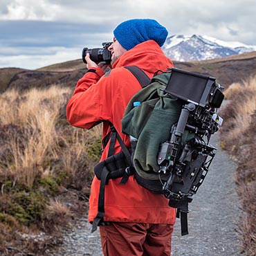 Photographer in outdoor clothing