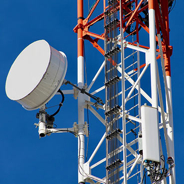 Telecoms aerial with equipment in thermoplastic enclosures