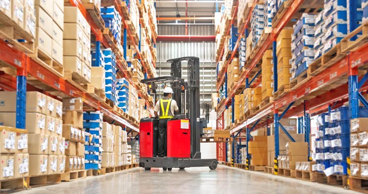 Fork lift truck working in a warehouse